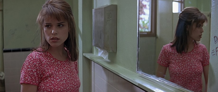 Sidney Prescott is being attacked within the school WC