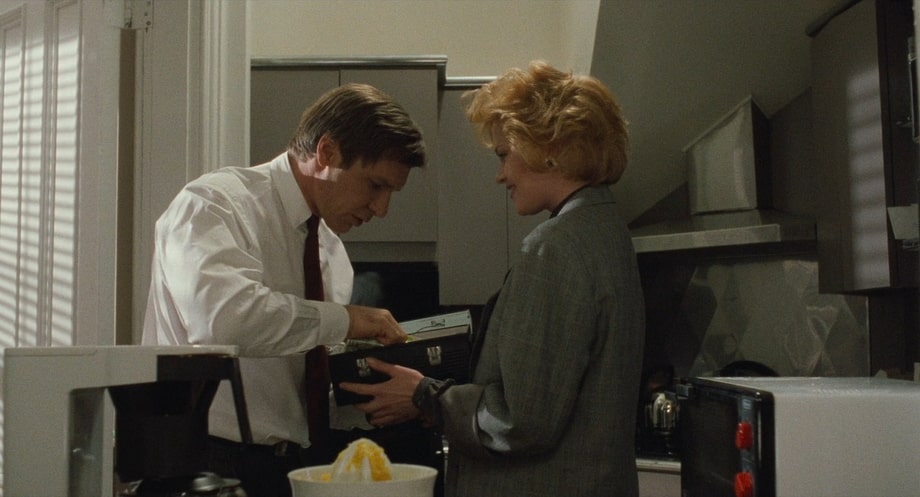 Jack Trainer (Harrison Ford) and Tess (Melanies Griffith)