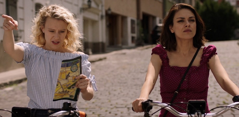 Mila Kunis (Audrey) and Kate McKinnon (Morgan)